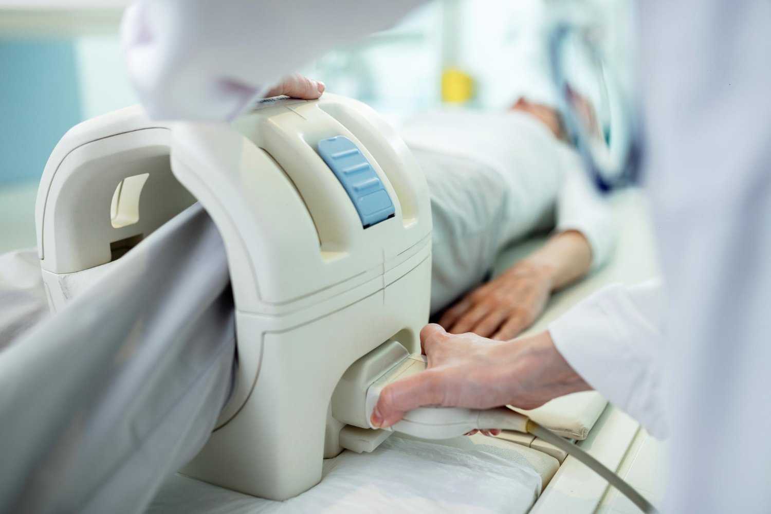 A well-lit examination room with a patient lying on a radiological scanning table, surrounded by medical equipment and staff in scrubs. In the foreground, a technician carefully explains the procedure to the patient, their expressions conveying a sense of reassurance. The middle ground features the scanner apparatus, its advanced technology and sleek design conveying precision and professionalism. In the background, other medical personnel monitor the scanning process, ensuring the utmost care and attention to detail. The overall atmosphere is one of competence, diligence, and a commitment to the patient's wellbeing.